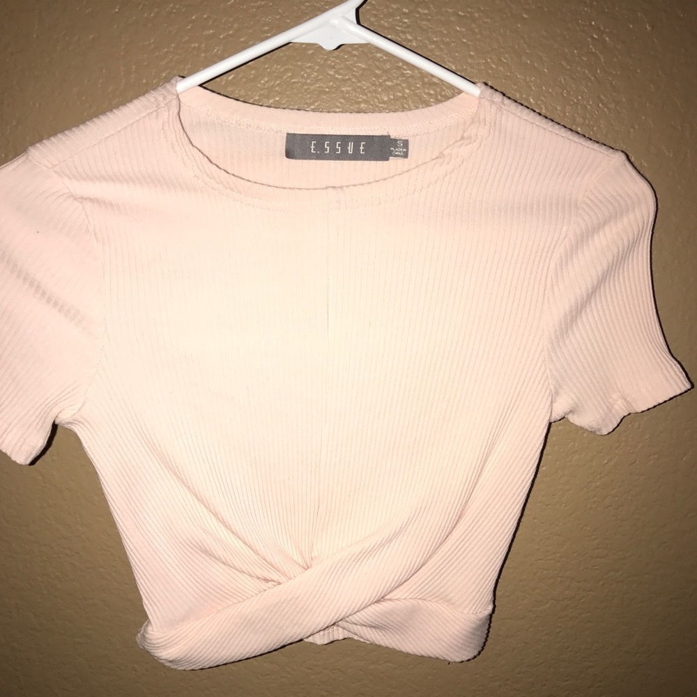 Cropped feint pink top.